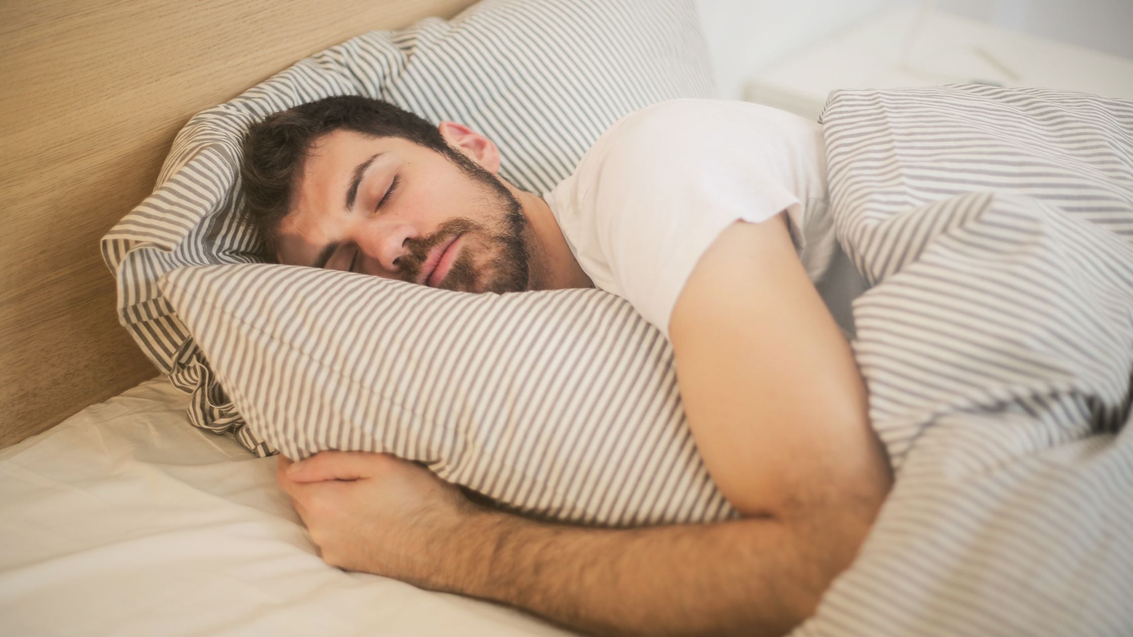 A boy in the bed having a good night sleep