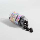 Wellmush Mushroom Raspberry Gummies  supplement jar open with few gummies dropped out with white background