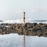 standing woman by the ocean 
